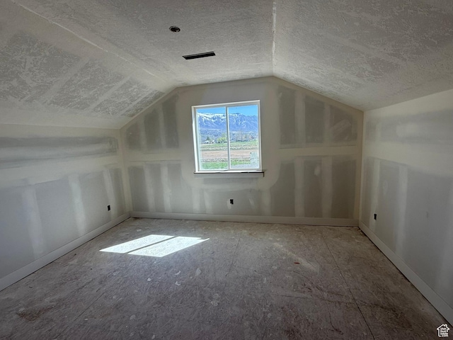 2405 W 3200 N, Farr West, UT 84404 - bonus room featuring visible vents, a textured ceiling, baseboards, and lofted ceiling