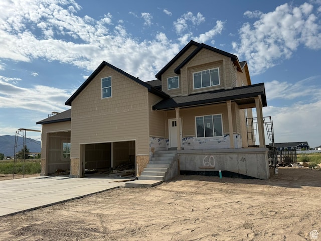 2405 W 3200 N, Farr West, UT 84404 - view of front facade featuring a garage, driveway, and a porch