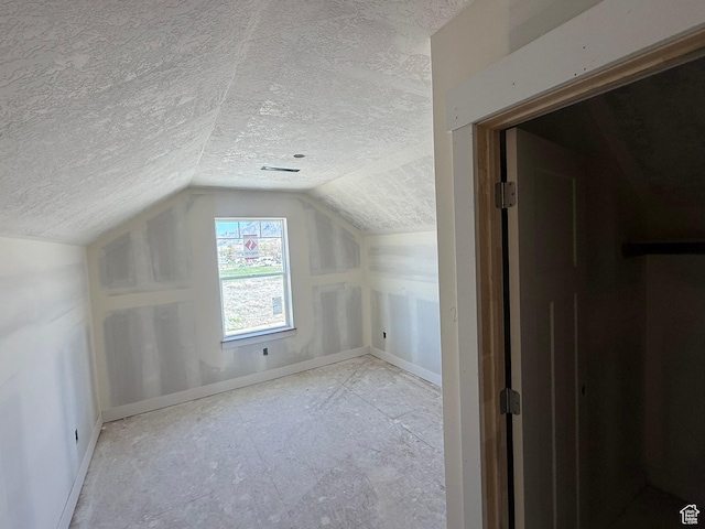 2405 W 3200 N, Farr West, UT 84404 - bonus room with a textured ceiling, baseboards, and lofted ceiling