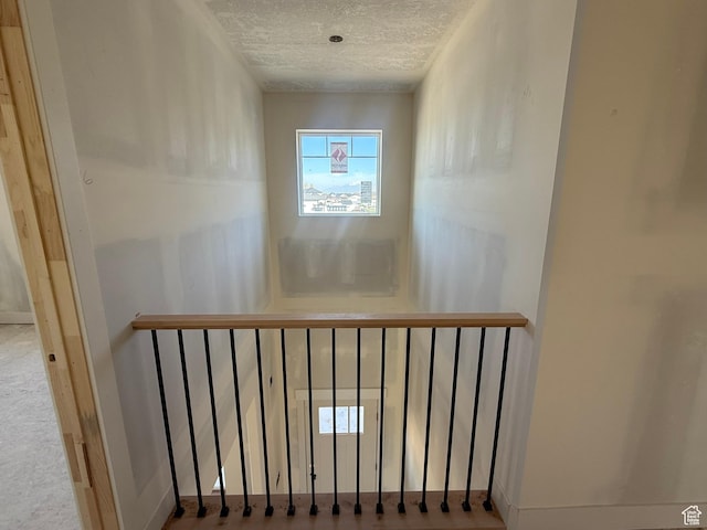 2405 W 3200 N, Farr West, UT 84404 - staircase featuring a textured ceiling