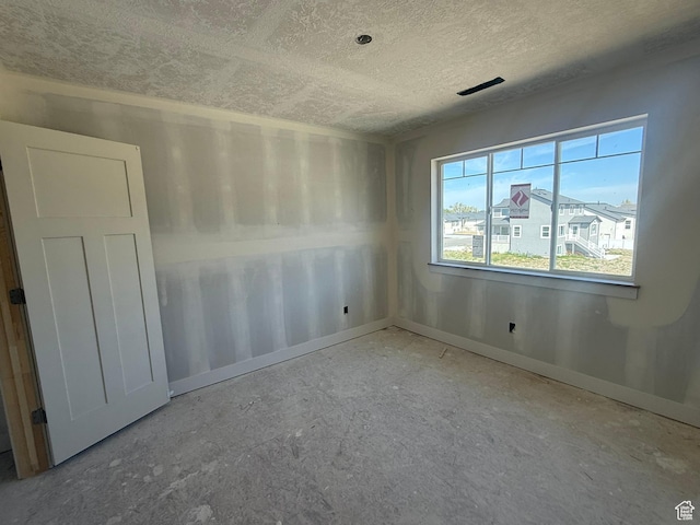 2405 W 3200 N, Farr West, UT 84404 - unfurnished room featuring baseboards and a textured ceiling
