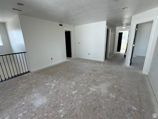 2405 W 3200 N, Farr West, UT 84404 - unfurnished room with a textured ceiling and healthy amount of natural light