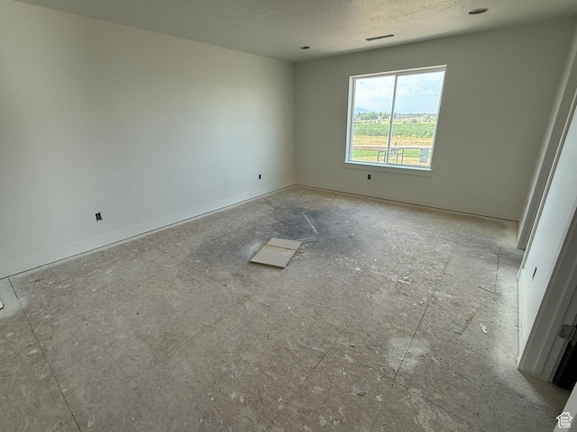 2405 W 3200 N, Farr West, UT 84404 - unfurnished room with a textured ceiling and baseboards