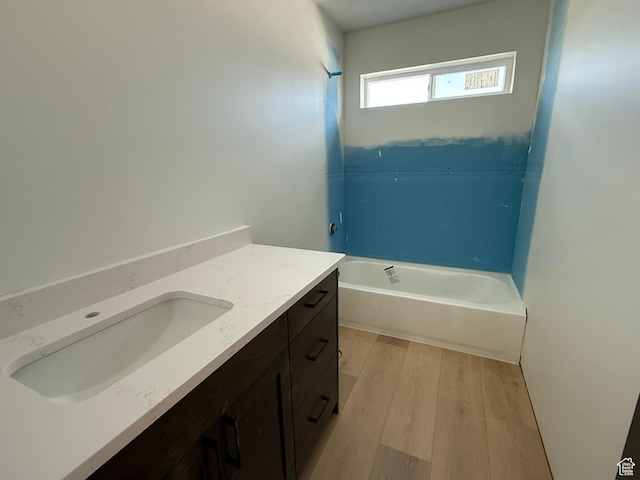 2405 W 3200 N, Farr West, UT 84404 - bathroom with a tub, vanity, and wood finished floors