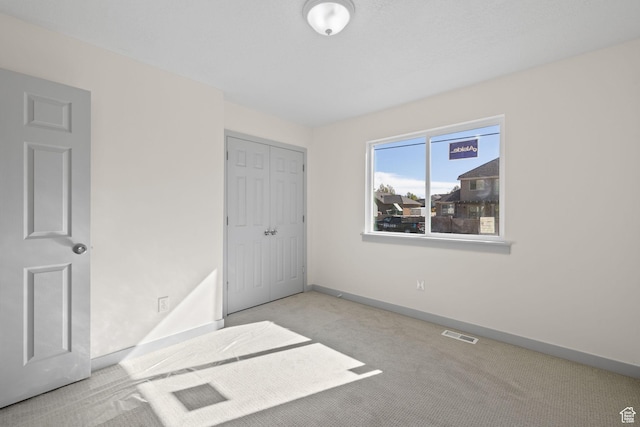 1614 N 160 E Unit 2, Orem, UT 84057 - unfurnished bedroom featuring a closet, baseboards, carpet, and visible vents