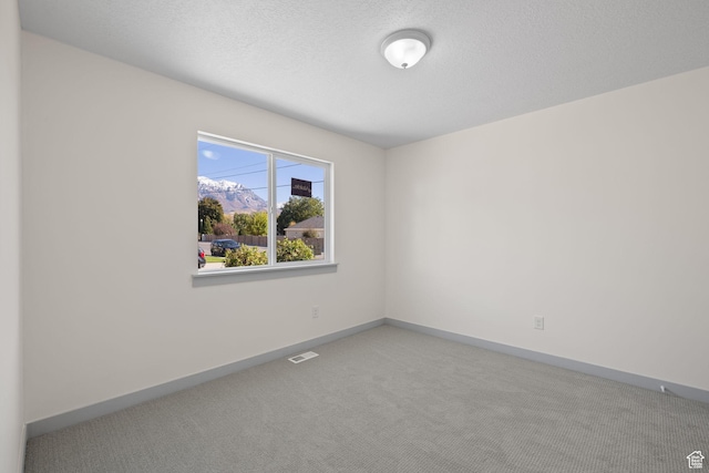 1614 N 160 E Unit 2, Orem, UT 84057 - spare room with visible vents, baseboards, and carpet floors