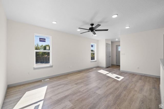 1614 N 160 E Unit 2, Orem, UT 84057 - empty room featuring visible vents, baseboards, ceiling fan, recessed lighting, and light wood finished floors
