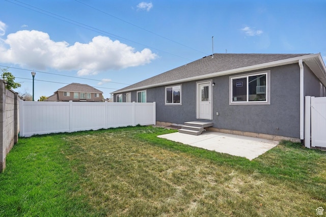 1614 N 160 E Unit 2, Orem, UT 84057 - back of property with a patio area, a fenced backyard, a lawn, and stucco siding