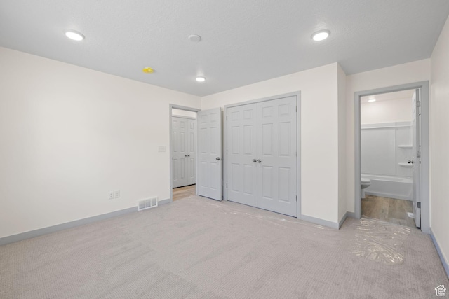 1614 N 160 E Unit 2, Orem, UT 84057 - unfurnished bedroom with ensuite bathroom, baseboards, visible vents, and carpet floors