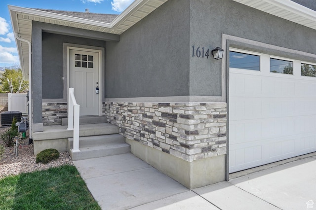 1614 N 160 E Unit 2, Orem, UT 84057 - view of exterior entry with a shingled roof, stone siding, and stucco siding