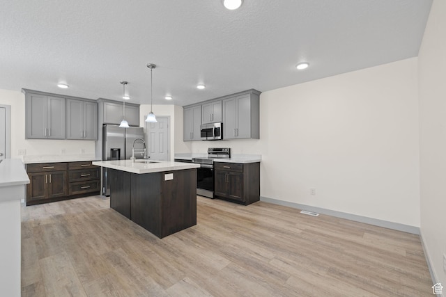 1614 N 160 E Unit 2, Orem, UT 84057 - kitchen featuring baseboards, light wood-style flooring, light countertops, stainless steel appliances, and a sink