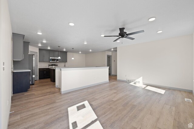 1614 N 160 E Unit 2, Orem, UT 84057 - unfurnished living room featuring light wood finished floors, ceiling fan, visible vents, and recessed lighting