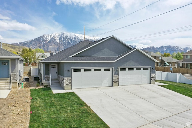 1614 N 160 E Unit 2, Orem, UT 84057 - single story home featuring stucco siding, stone siding, an attached garage, a mountain view, and concrete driveway