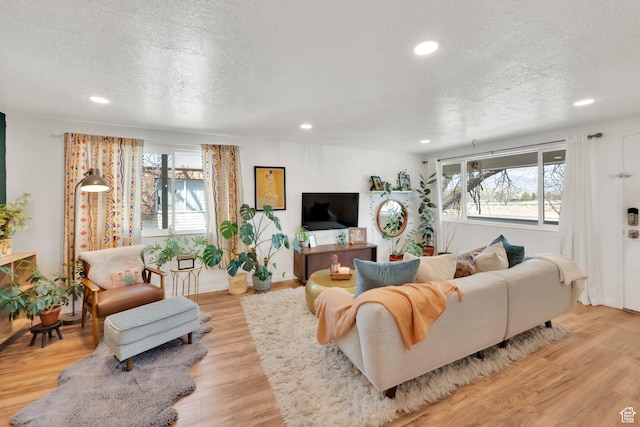 4338 S 1100 W Unit 36D, Taylorsville, UT 84123 - living room with a wealth of natural light, recessed lighting, and a textured ceiling