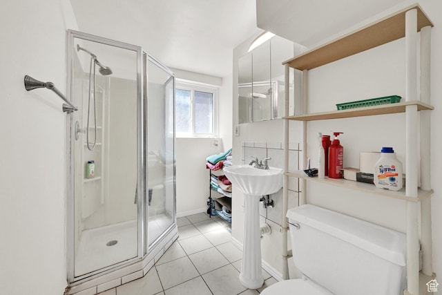 1705 W 4575 S, Roy, UT 84067 - bathroom with a stall shower, toilet, tile patterned flooring, and baseboards