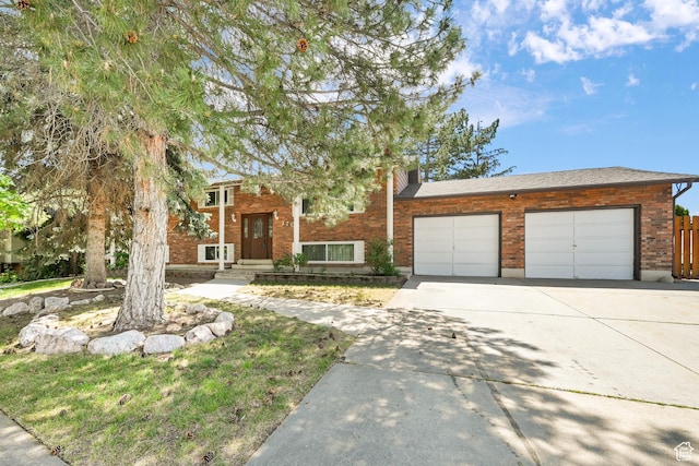 1705 W 4575 S, Roy, UT 84067 - view of front of house with concrete driveway and a garage