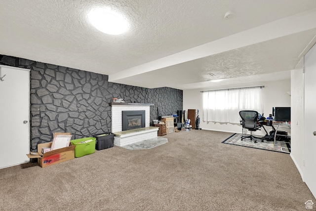 1705 W 4575 S, Roy, UT 84067 - carpeted living room featuring a textured ceiling, a brick fireplace, a desk, and baseboards