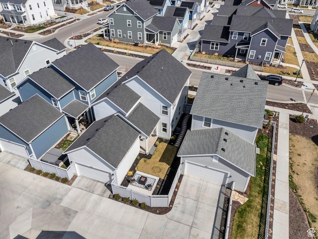 birds eye view of property with a residential view