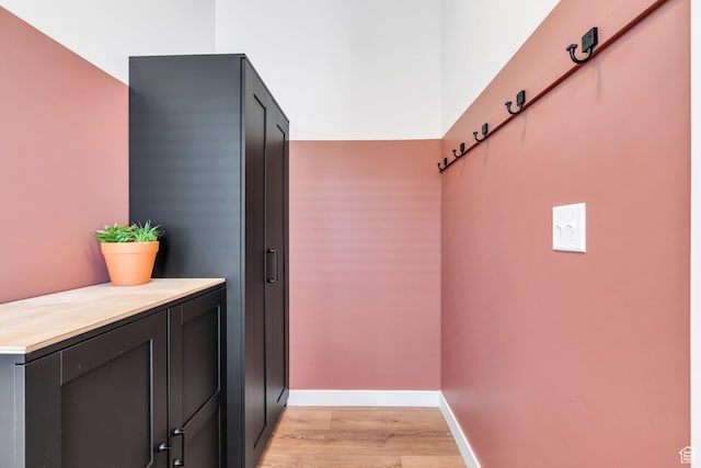 interior space with light wood-style floors and baseboards