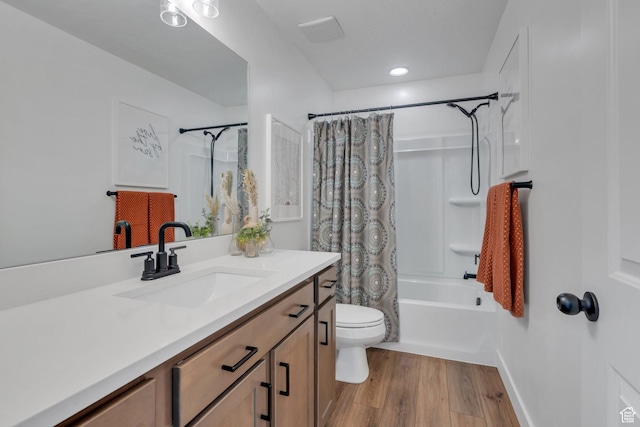 full bathroom with baseboards, toilet, shower / tub combo with curtain, vanity, and wood finished floors