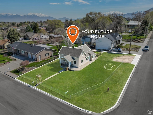 birds eye view of property with a residential view and a mountain view