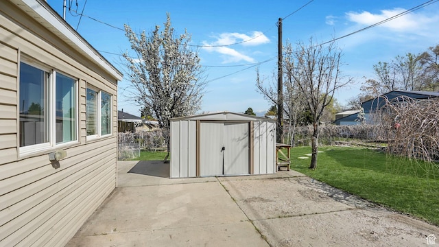 view of shed featuring fence