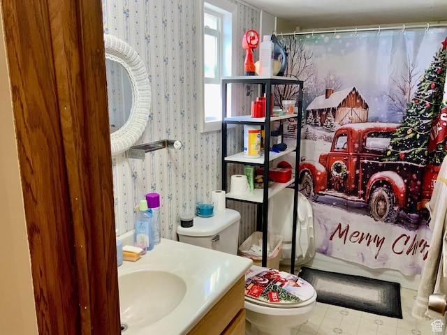 162 S Center St, Elsinore, UT 84724 - bathroom with tile patterned floors, vanity, wallpapered walls, and toilet