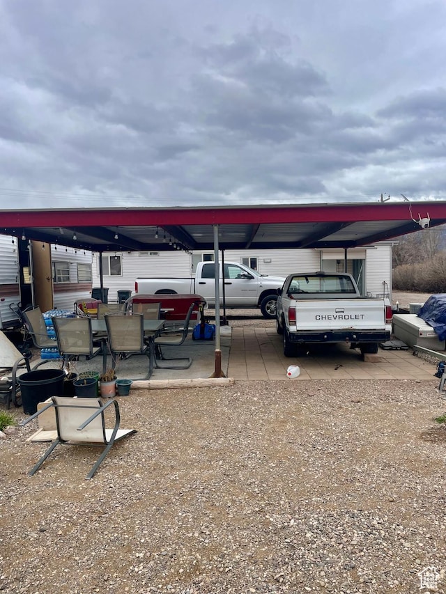 162 S Center St, Elsinore, UT 84724 - view of parking featuring an attached carport