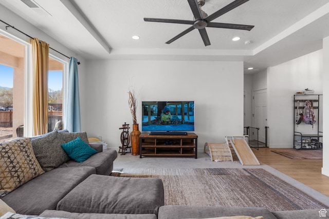 4898 N 10 E, Enoch, UT 84721 - living area with recessed lighting, a ceiling fan, visible vents, a tray ceiling, and wood finished floors