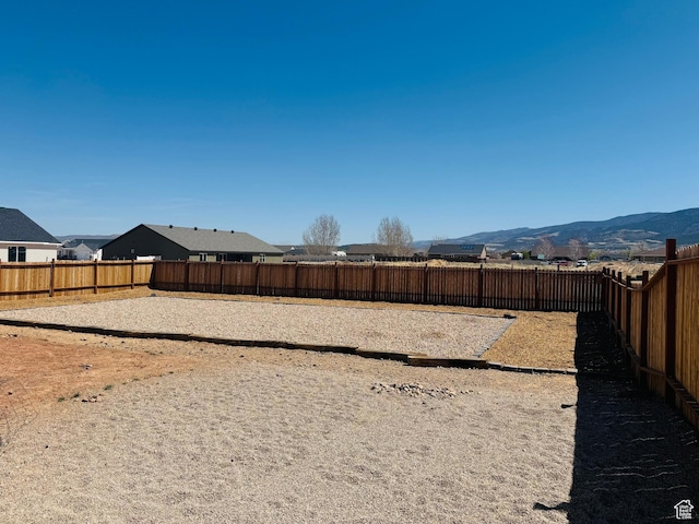 4898 N 10 E, Enoch, UT 84721 - view of yard featuring a mountain view and a fenced backyard