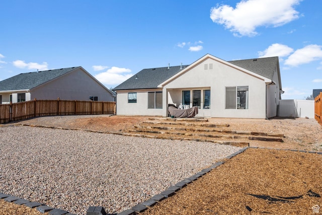 4898 N 10 E, Enoch, UT 84721 - back of property featuring a fenced backyard and stucco siding