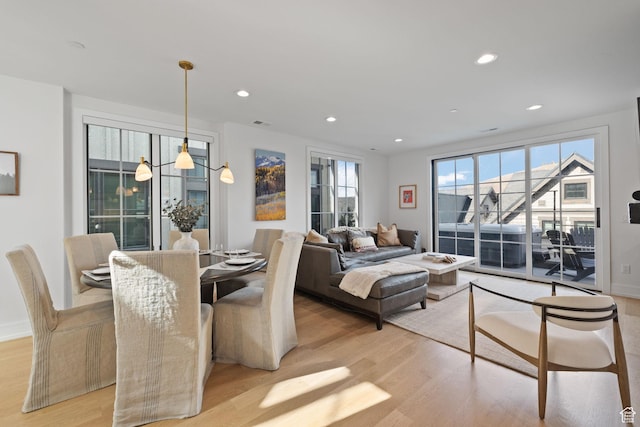 interior space featuring recessed lighting, light wood finished floors, and visible vents