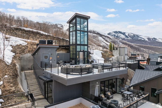 exterior space with stairway and a mountain view