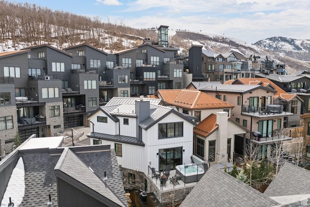 drone / aerial view featuring a mountain view and a residential view