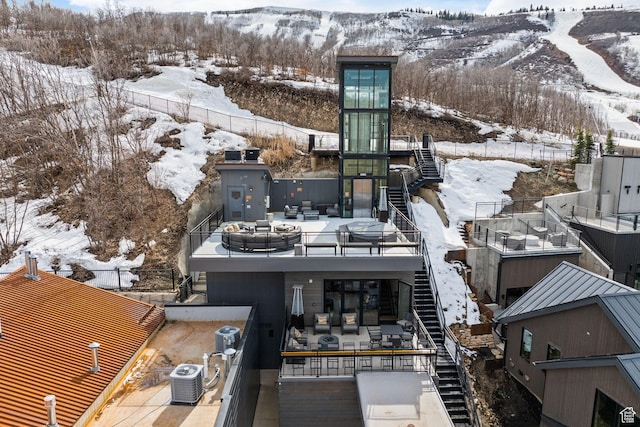 snowy aerial view featuring a mountain view