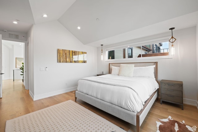 bedroom featuring visible vents, baseboards, light wood finished floors, recessed lighting, and lofted ceiling
