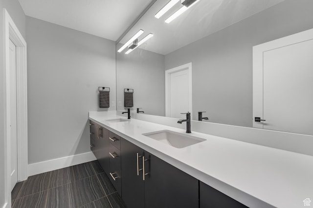 3131 E Lindsay Spring Rd, Heber City, UT 84032 - bathroom with double vanity, baseboards, and a sink