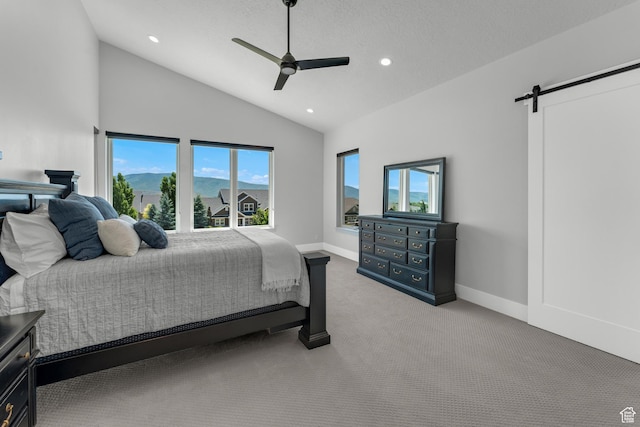 3131 E Lindsay Spring Rd, Heber City, UT 84032 - bedroom featuring a barn door, a ceiling fan, recessed lighting, vaulted ceiling, and light colored carpet