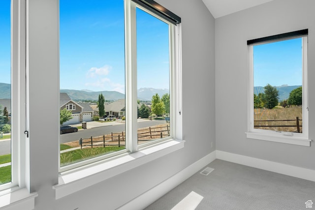 3131 E Lindsay Spring Rd, Heber City, UT 84032 - carpeted spare room with a mountain view, a wealth of natural light, visible vents, and baseboards