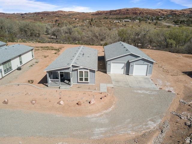 drone / aerial view featuring a mountain view