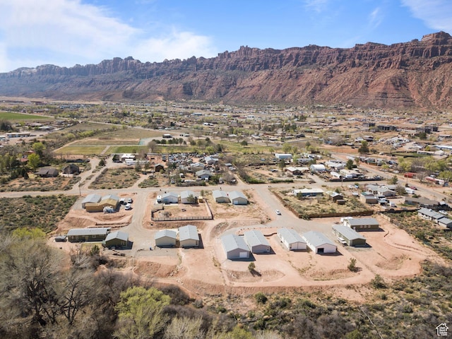 birds eye view of property featuring a mountain view