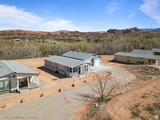 aerial view with a mountain view and view of desert