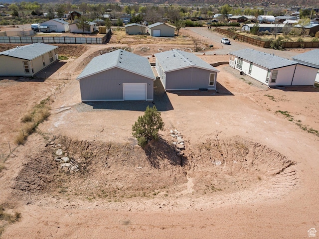 birds eye view of property with a residential view
