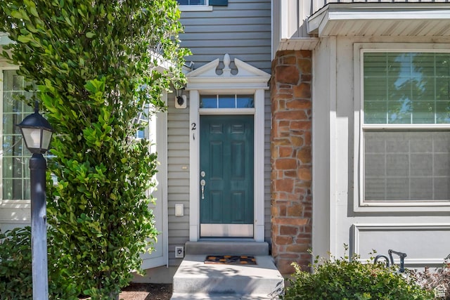 property entrance with brick siding