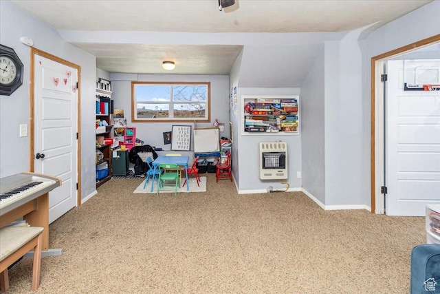 game room with baseboards, heating unit, and carpet