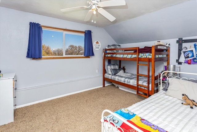 bedroom with carpet flooring, baseboards, a ceiling fan, and vaulted ceiling
