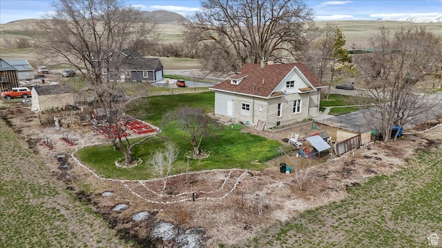 birds eye view of property featuring a mountain view