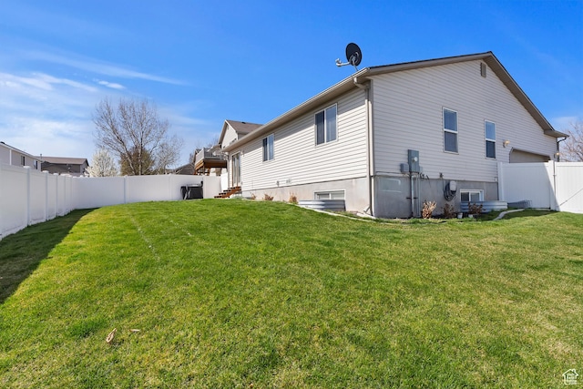 6761 S High Bluff Dr W, West Jordan, UT 84084 - back of house with a yard and a fenced backyard