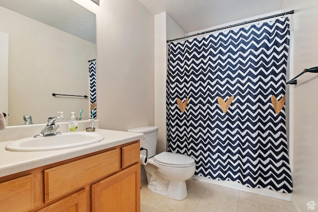 6761 S High Bluff Dr W, West Jordan, UT 84084 - full bathroom with a shower with shower curtain, tile patterned floors, vanity, and toilet