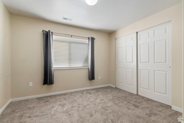 6761 S High Bluff Dr W, West Jordan, UT 84084 - unfurnished bedroom with a closet, baseboards, and carpet